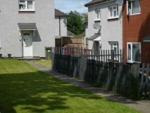 Property survey for a side yard in Frisco, Texas, showing a narrow residential space with fencing, walkway, lawn, and nearby homes.